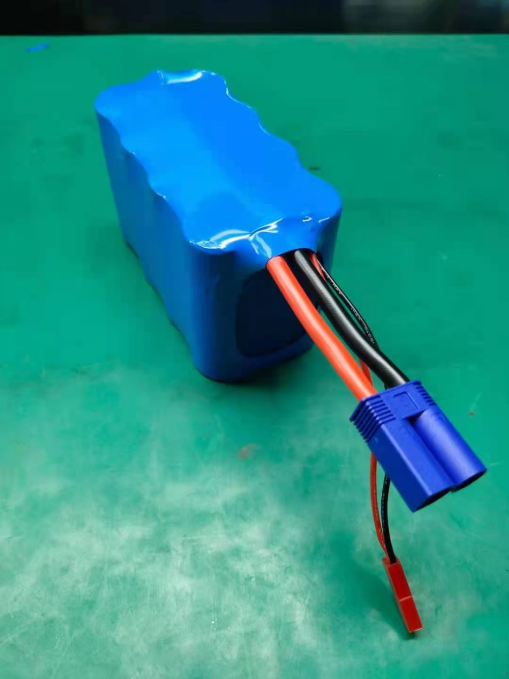 Motorcycle starter battery terminals and housing